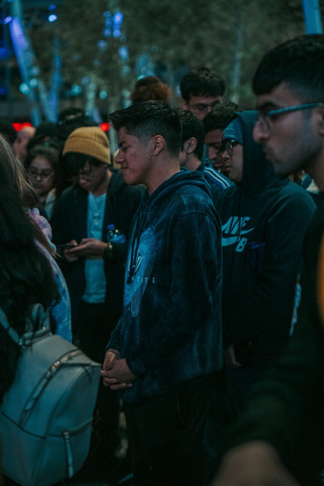 crowd of people looking at phones