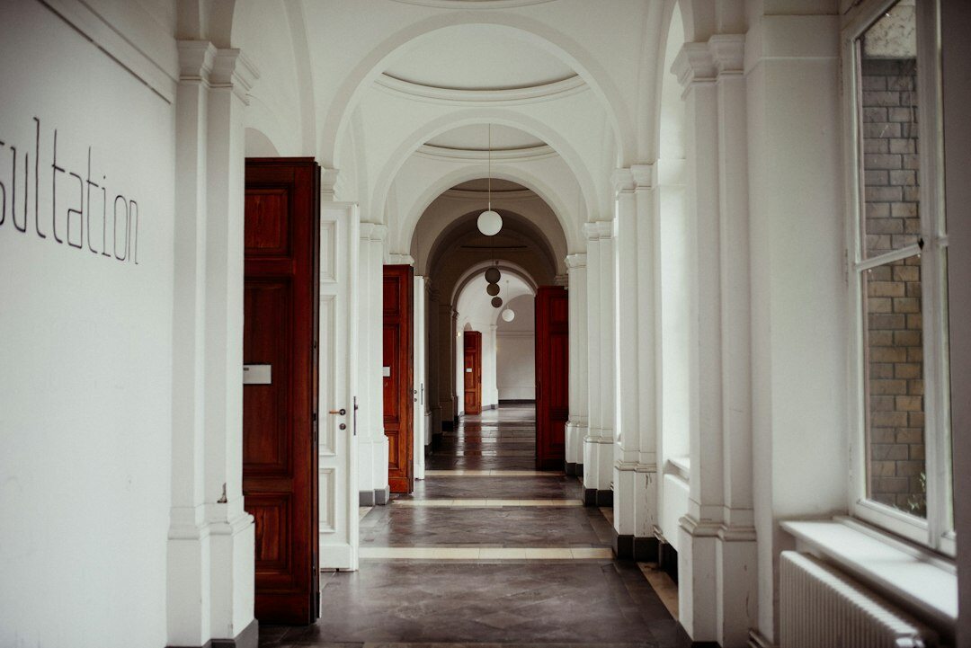 Empty minimalist museum corridor with soft natural light