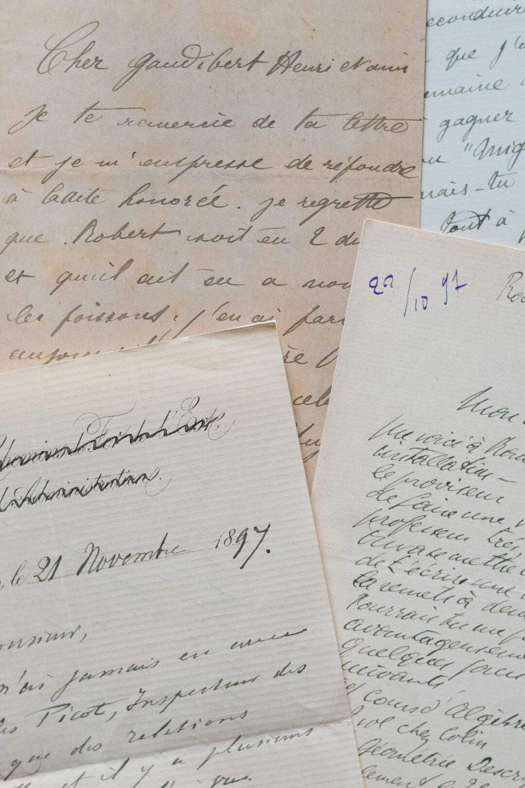 Close-up of archival research papers and handwritten notes on a desk