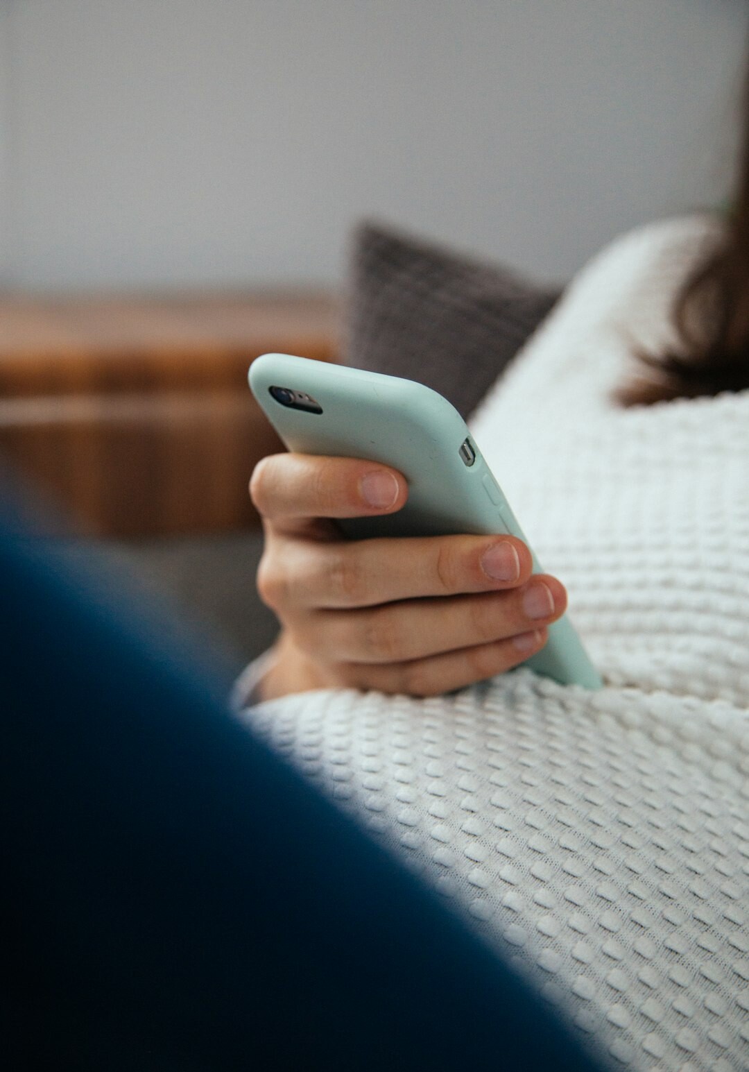 person scrolling through phone news