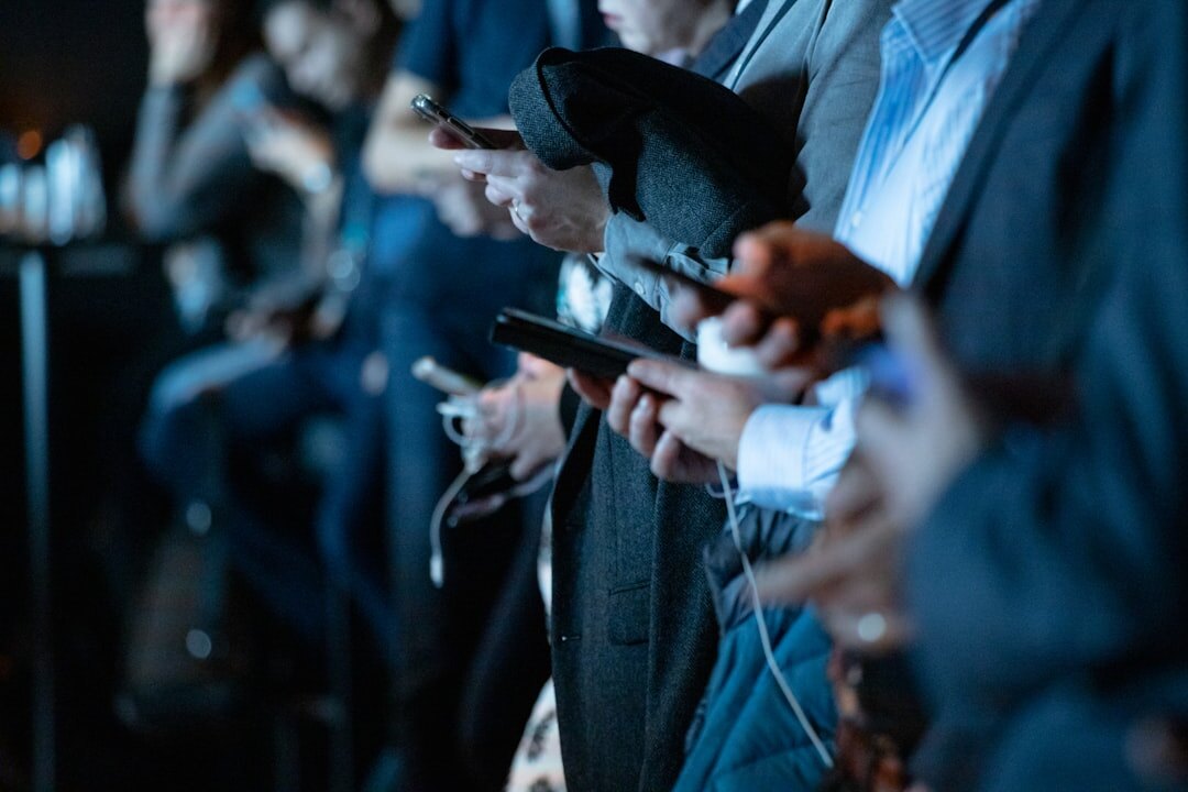 crowd of people looking at phones